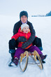 Foto: mother and daughter on a sled mother and daughter on a sled
