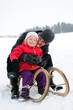 Foto: mother and daughter on a sled mother and daughter on a sled
