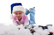 Beautiful girl in Santa's hat in tinsel and artificial snow Beautiful girl in Santa's hat in tinsel and artificial snow