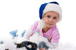 Beautiful girl in Santa's hat in tinsel and artificial snow Beautiful girl in Santa's hat in tinsel and artificial snow