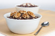 Two bowls with traditional Christmas kutia dessert on yellow nap