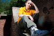 Teenage hip-hop girl on red brick wall