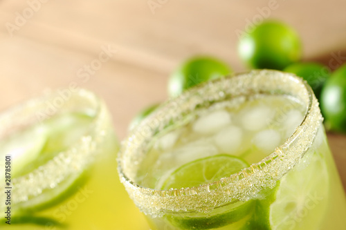 Photo: Fresh lemonade of green limes in sugar-rimmed glasses Fresh lemonade of green limes in sugar-rimmed glasses