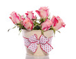 pink orange roses in an iron bucket with ribbon isolated over wh pink orange roses in an iron bucket with ribbon isolated over wh