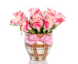 pink orange roses in a brown checkered vase with ribbon isolated pink orange roses in a brown checkered vase with ribbon isolated