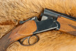 Open rifle on fox fur Open rifle on fox fur