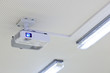 overhead lcd projector in a modern classroom (color toned image)