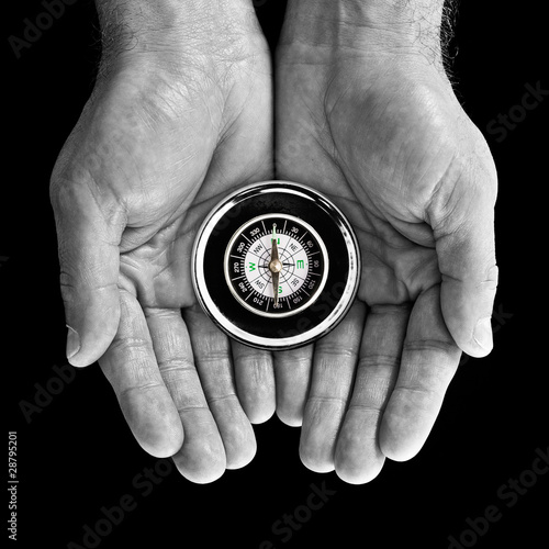 Photo: Compass in hands Compass in hands