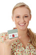 Happy young woman holding house model Happy young woman holding house model