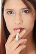 Young woman smoking electronic cigarette
