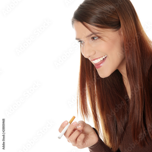 Photo: Young woman smoking electronic cigarette Young woman smoking electronic cigarette