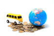 Globe and car on the pile of coins - isolated Globe and car on the pile of coins - isolated