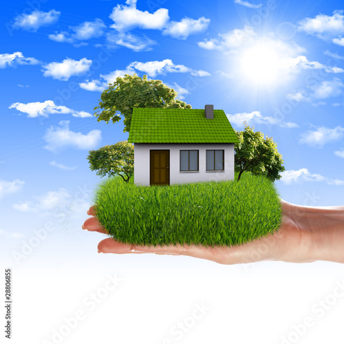 Illustration: House in the hands against the blue sky House in the hands against the blue sky