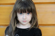 Sad adorable girl with long dark hair and beauty blue eyes Sad adorable girl with long dark hair and beauty blue eyes