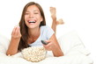 Woman watching funny movie laughing Woman watching funny movie laughing
