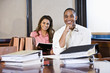 Multiracial businesspeople working on documents