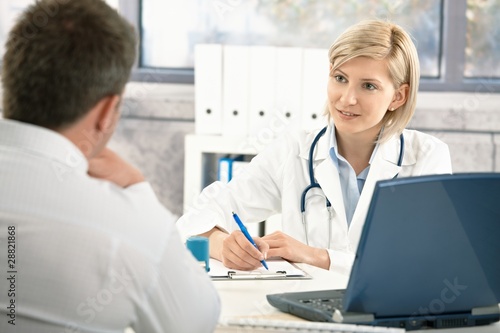 Photo: Doctor taking notes about patient Doctor taking notes about patient