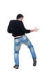 Young man dancing. Rear view. Young man dancing. Rear view.