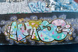 Abstract graffiti fragment on the textured brick wall
