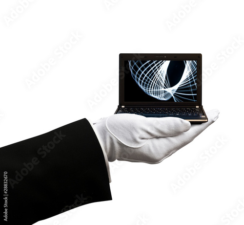Photo: Holding netbook laptop Holding netbook laptop