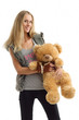 cheerful young woman with teddy bear