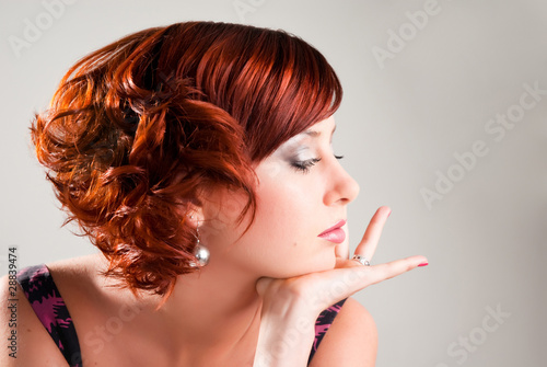 Photo: portrait of attractive red haired young woman portrait of attractive red haired young woman