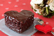 Heart shaped chocolate cake and a bouquet Heart shaped chocolate cake and a bouquet