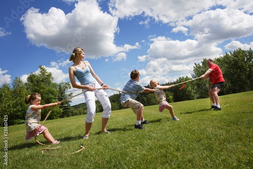 Photo: Tug Of War Between Dad And Mom With Kids Tug Of War Between Dad And Mom With Kids