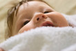 a little boy lying on sofa