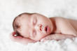 Newborn baby sleeping. Soft focus, shallow DoF.