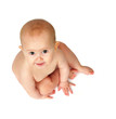 Baby sitting on floor looking up at camera Baby sitting on floor looking up at camera