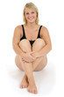 Photo: Junge Frau im Badeanzug sitzt Junge Frau im Badeanzug sitzt