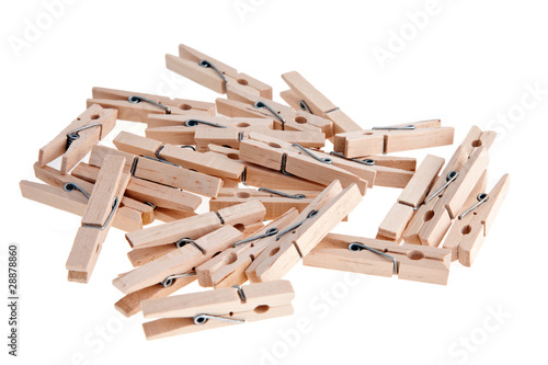 Photo: Wooden clothespins on white background Wooden clothespins on white background