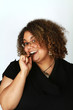 Smiling Woman Eats Dark Chocolate Smiling Woman Eats Dark Chocolate