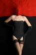 Fashion shoot of a young woman covered with red silk Fashion shoot of a young woman covered with red silk