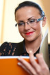 Young pretty woman with orange book in hands Young pretty woman with orange book in hands