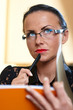 Young pretty woman with orange book in hands Young pretty woman with orange book in hands