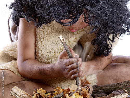 Photo: child making fire by friction child making fire by friction