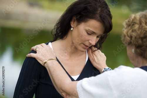 Photo: Senior Woman Consoling Her Daughter Senior Woman Consoling Her Daughter