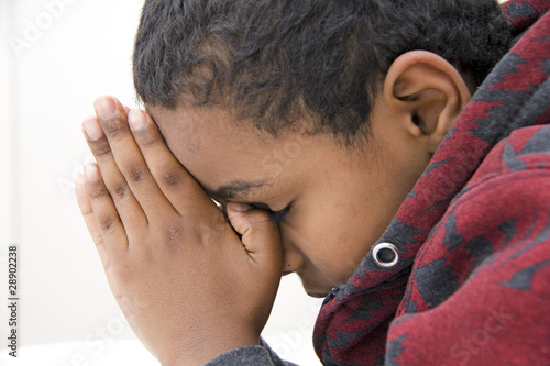 Photo: A Young kid praying A Young kid praying