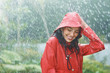 Woman enjoying rain outdoors