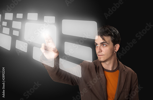 Photo: man pressing a touchscreen button man pressing a touchscreen button