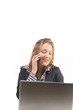 Woman behind laptop with phone