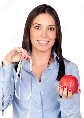 Photo: Beautiful girl with a red apple and tape-measure Beautiful girl with a red apple and tape-measure