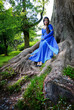 Photo: elf princess in roots of big tree elf princess in roots of big tree