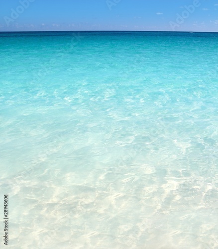 Photo: Caribbean turquoise sea beach shore white sand Caribbean turquoise sea beach shore white sand