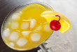 Maraschino cherry and orange slice on cocktail