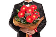 A man holding a large bouquet of flowers