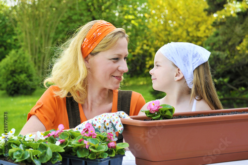Photo: Mother and daughter having gardening time Mother and daughter having gardening time