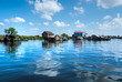 Floating House and  Houseboat on the Tonle Sap lake, Cambodia.
